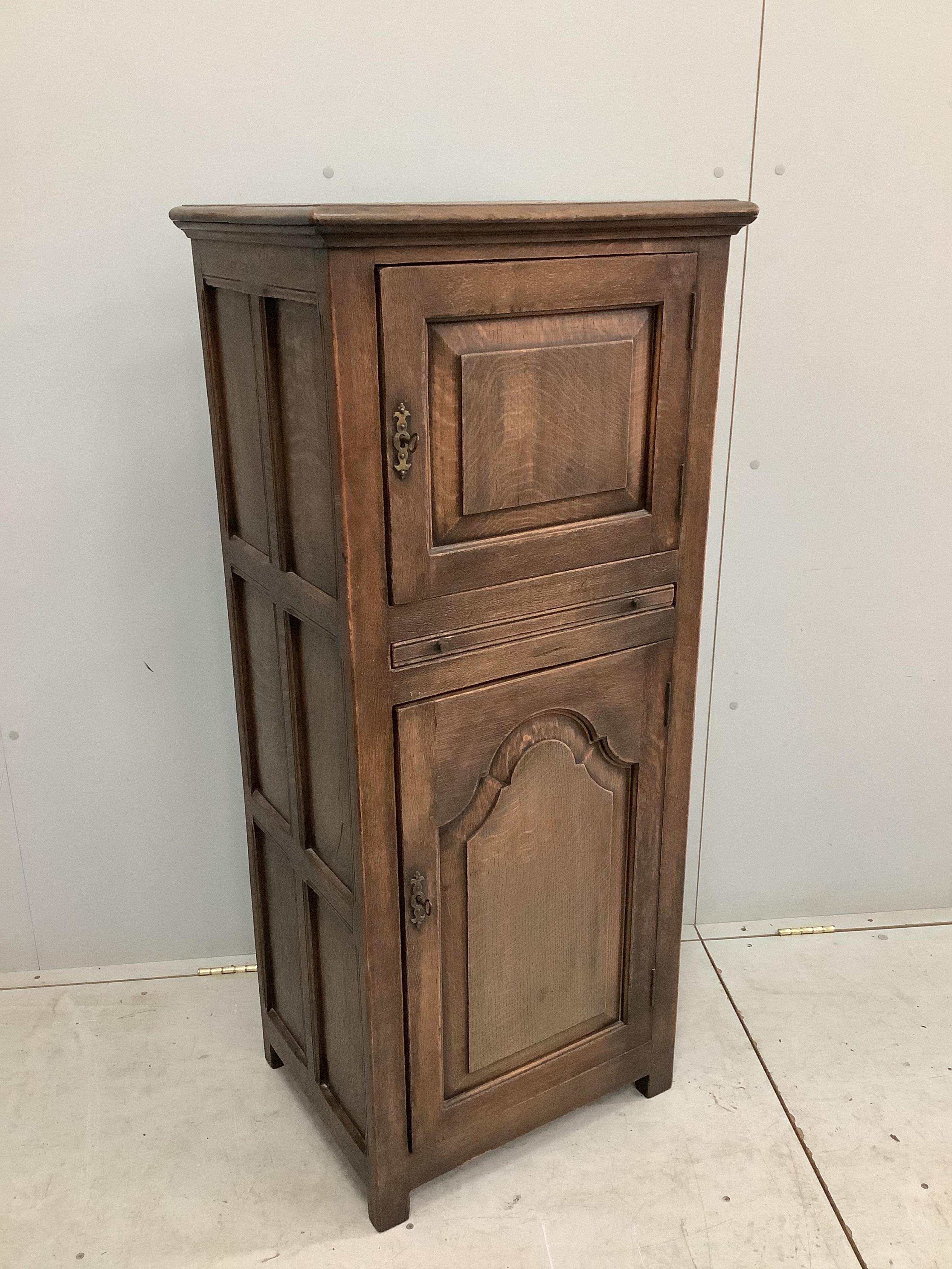 A 17th century style Ipswich oak cabinet, width 56cm, depth 42cm, height 129cm. Condition - fair to good